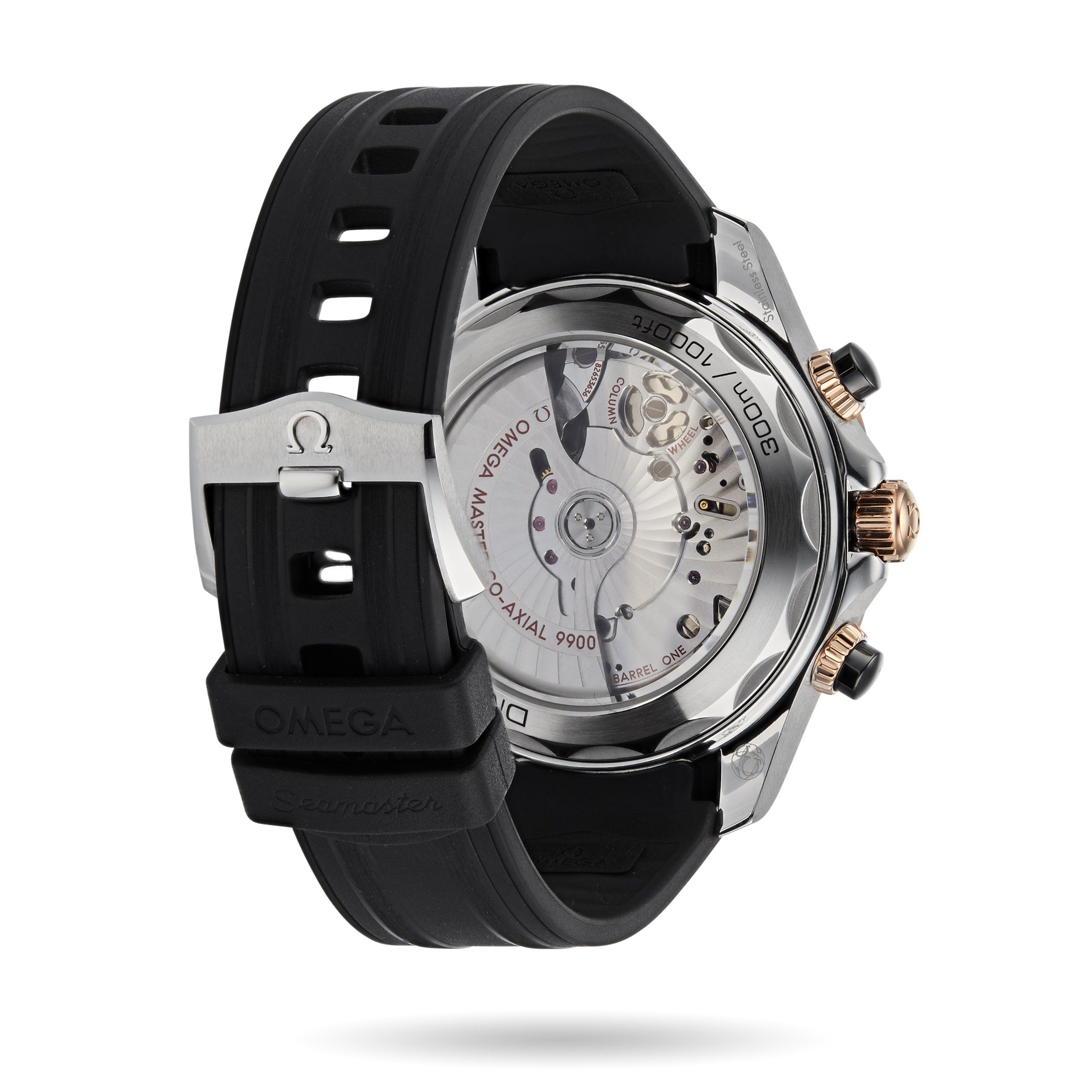 A close-up of the back of an OMEGA Seamaster Diver 300M watch shows its transparent case revealing the movement, black rubber strap, and metal clasp with the OMEGA logo.