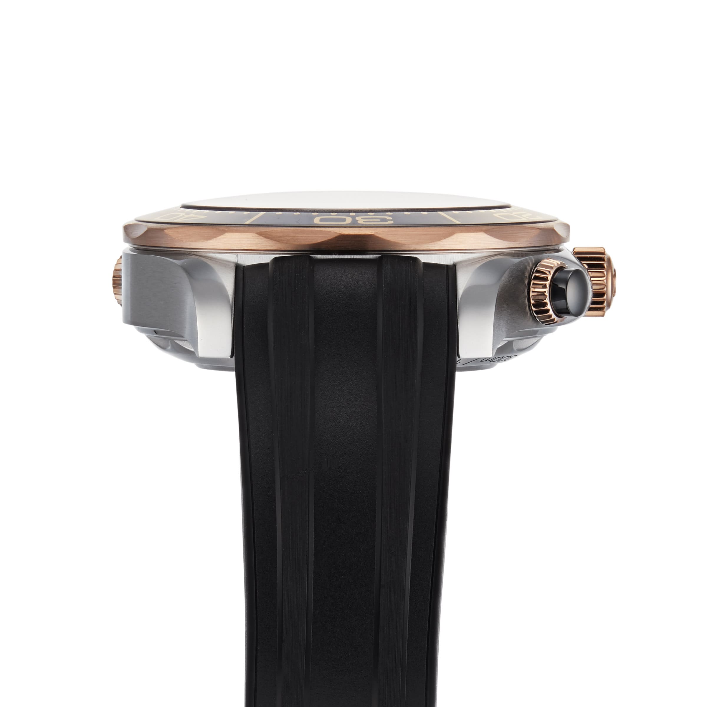 Side view of the OMEGA Seamaster Diver 300M, featuring a black rubber strap, rose gold bezel, and a crown with a black accent.