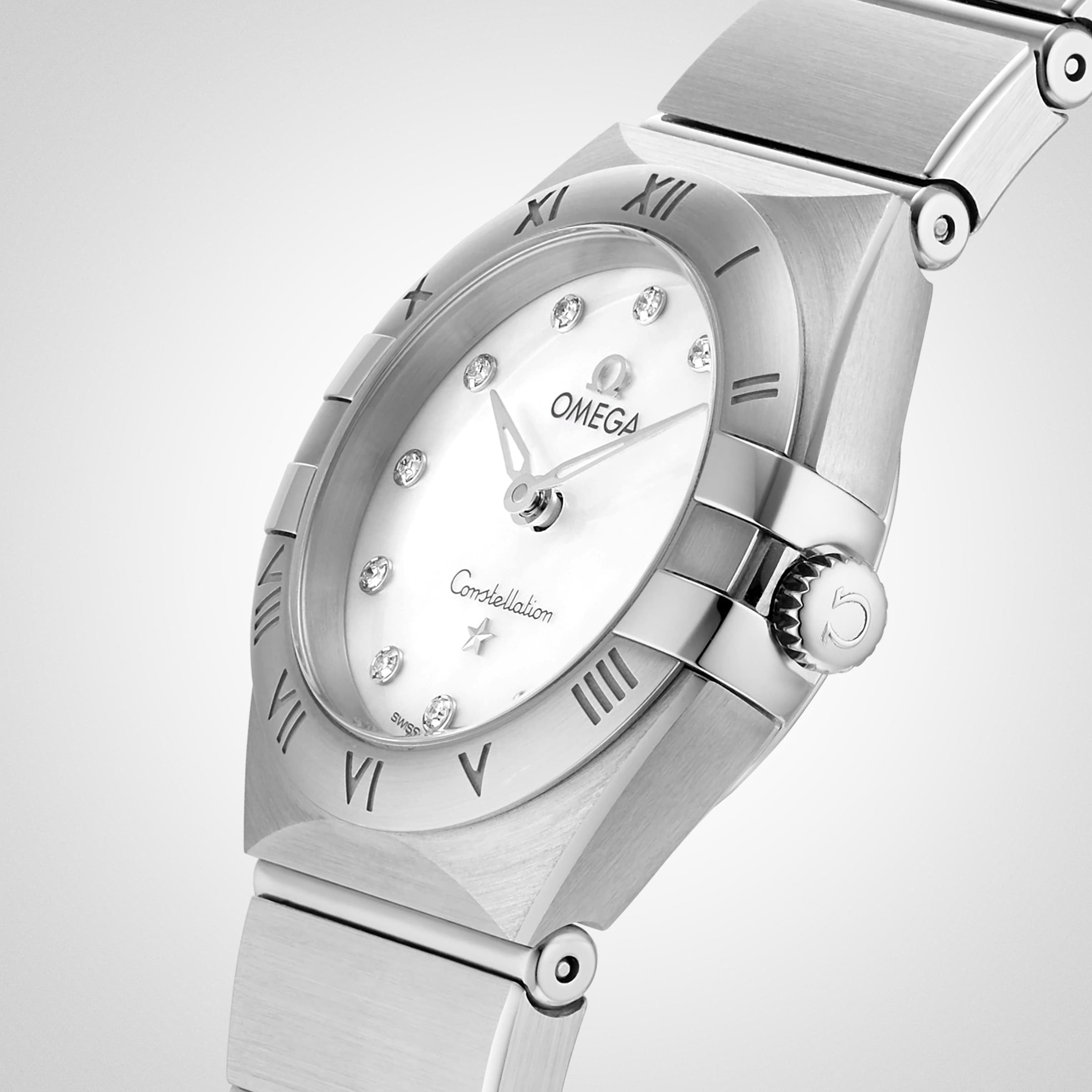 The OMEGA Constellation features a 28mm stainless steel case, white mother-of-pearl dial with diamond hour markers, Roman numeral bezel, and stainless steel bracelet. Shown at an angle.
