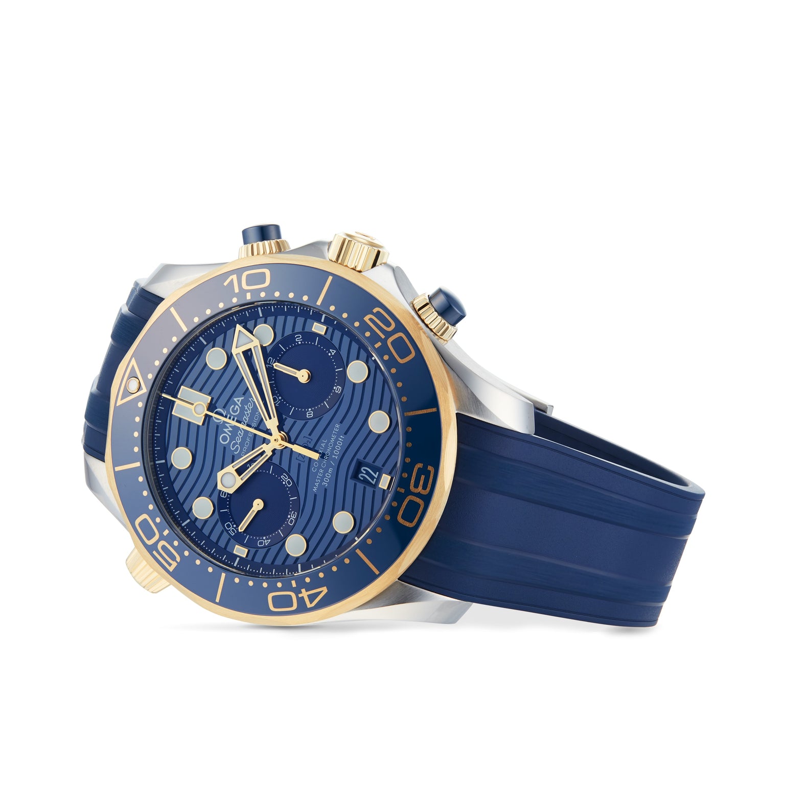 The OMEGA Seamaster Diver 300M, a blue and gold chronograph with three subdials, date window, blue rubber strap, and Ceragold™ diving scale, is angled against a white background.