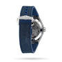 The image displays the back of the OMEGA Constellation wristwatch, featuring a blue leather strap, transparent case back with visible 8900 calibre movement, and an OMEGA-branded clasp.