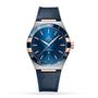 The OMEGA Constellation is a blue wristwatch featuring a blue leather strap, gold accents, Roman numerals, date at 6 o’clock, and is powered by the Master Chronometer certified 8900 calibre movement.