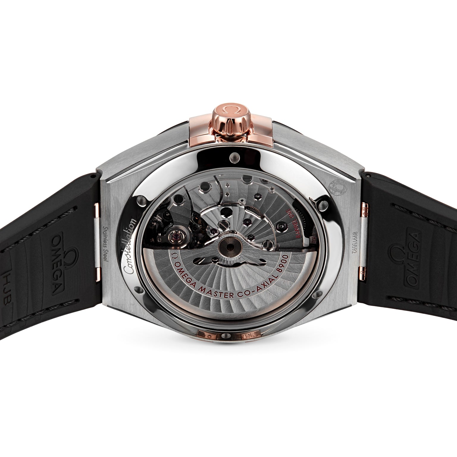 Close-up of the back of an OMEGA Constellation watch, showing a transparent case that reveals the mechanical movement and components, featuring a black strap and rose gold accents.