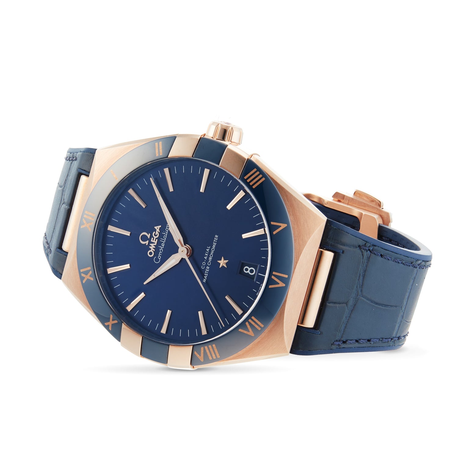The OMEGA Constellation features a blue leather strap, blue dial, Sedna™ gold Roman numerals, and a date display at 3 oclock—capturing the collections distinctive elegance.