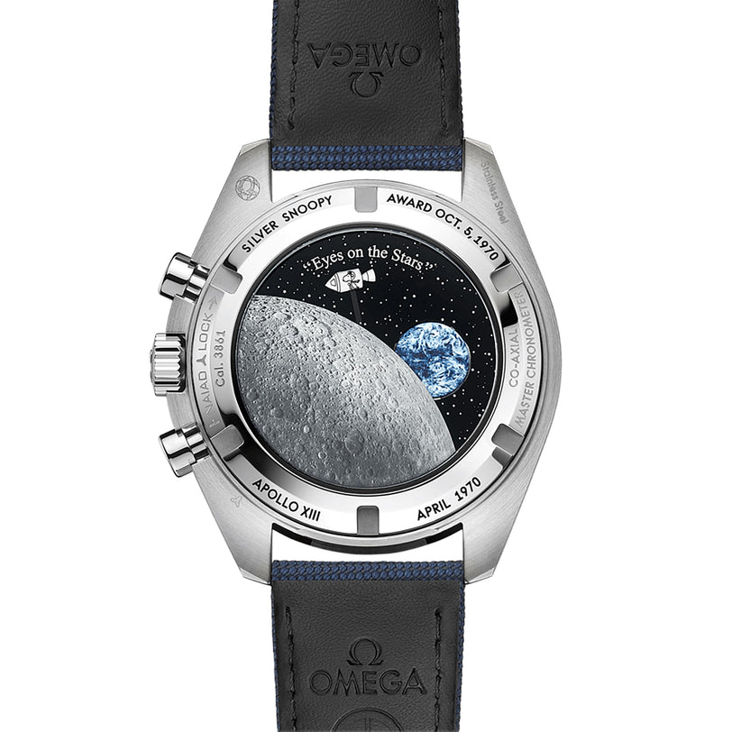 The OMEGA Speedmaster Snoopy Award Anniversary Series showcases its heritage with an engraved caseback featuring Apollo XIII tributes, the Silver Snoopy Award, the moon, Earth, and detailed mission engravings.