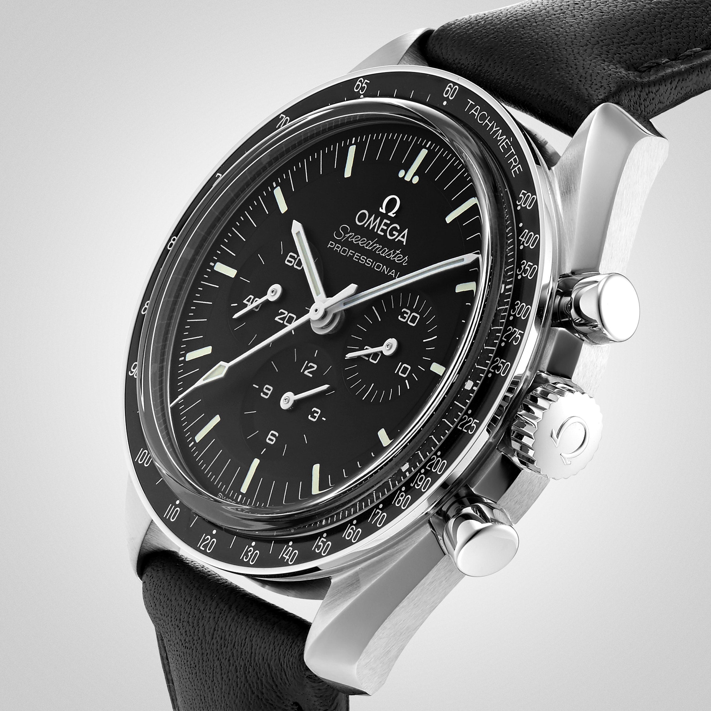 Close-up of the OMEGA Speedmaster Moonwatch Professional with black dial, three subdials, tachymeter bezel, and black leather strap, powered by the calibre 3861 Master Chronometer movement.