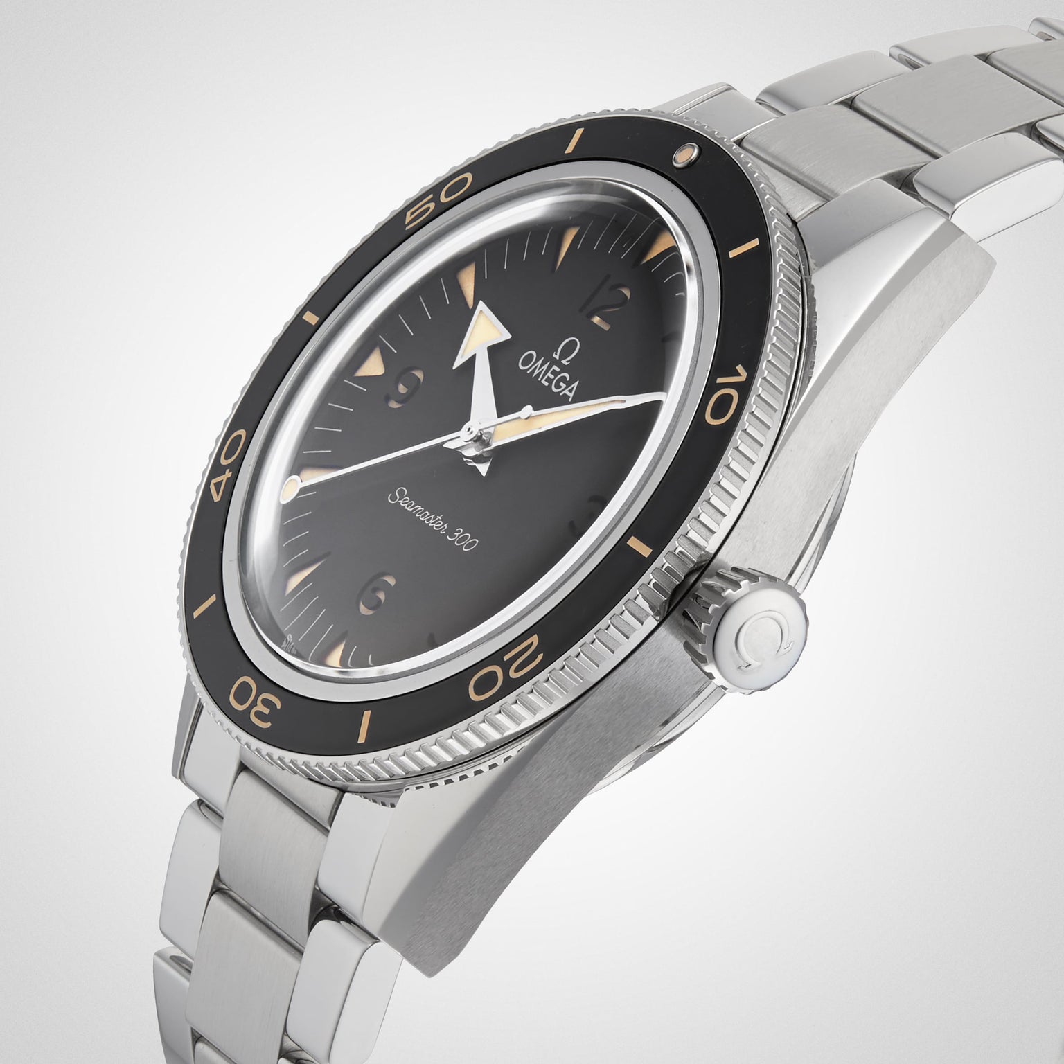 A stainless steel OMEGA Seamaster 300 wristwatch with black dial, domed crystal, rotating bezel, and metal bracelet showcases the Co-Axial Master Chronometer Calibre 8912 movement, photographed at an angle on a light background.