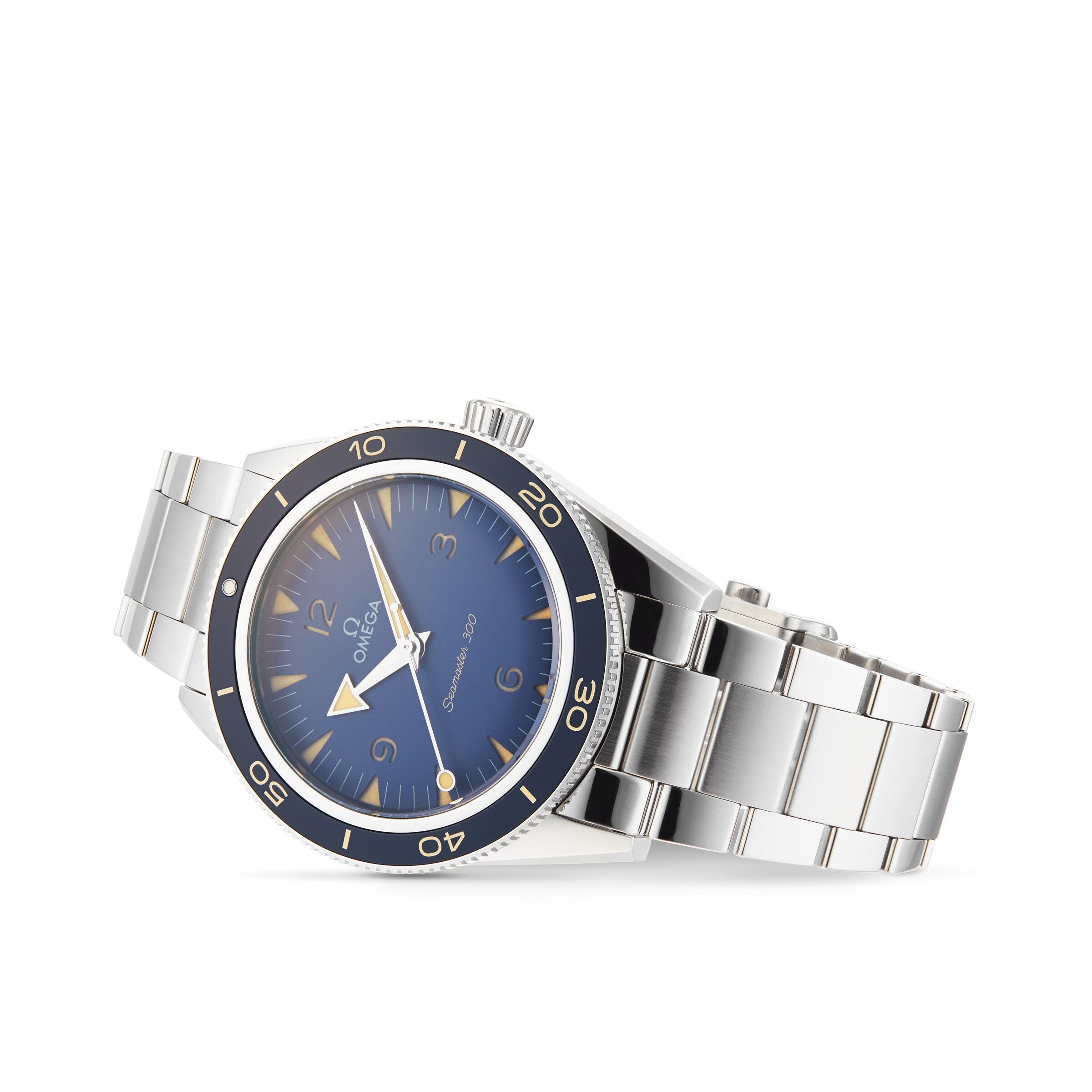 The OMEGA Seamaster 300, a stainless steel dive watch with a blue dial and bezel, silver hour markers, and a metal bracelet, is shown angled against a white background, reflecting OMEGA’s Master Chronometer precision.