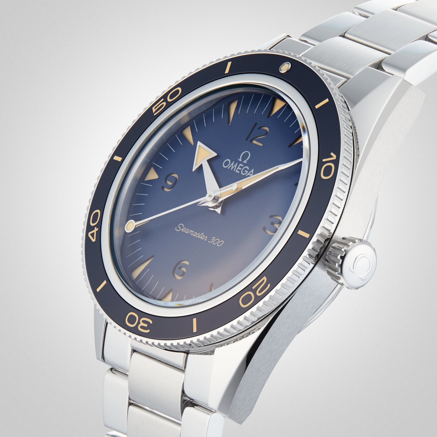 A close-up of the OMEGA Seamaster 300 dive watch, showcasing its blue dial, rotating bezel, and stainless steel bracelet.