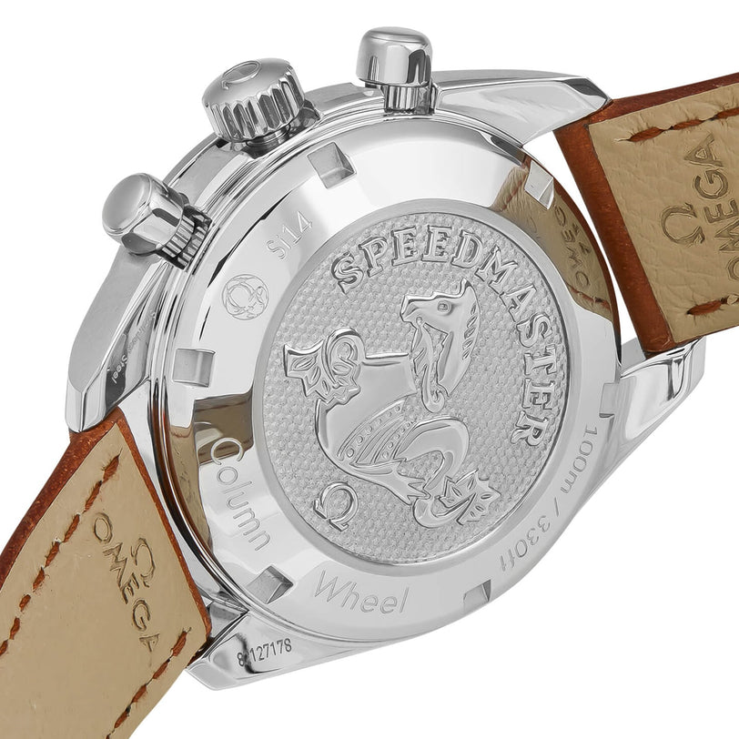 Close-up of the back of an OMEGA Speedmaster 38, featuring its engraved logo, brown leather strap, and refined stainless steel case details.