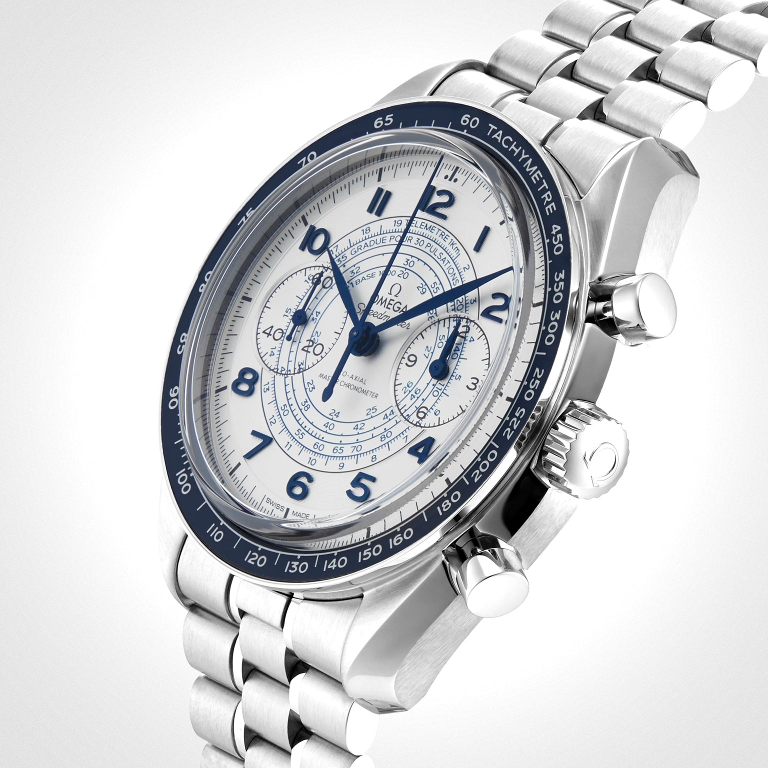 The OMEGA Speedmaster Chronoscope, featuring a stainless steel case, white and blue dial, tachymeter bezel, chronograph pushers, and metal link bracelet, is photographed against a light background.