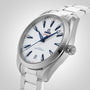 A close-up of the OMEGA Seamaster Aqua Terra 150M wristwatch, featuring a white dial, blue hour markers, red seconds hand, stainless steel bracelet, and precise 8900 calibre movement.