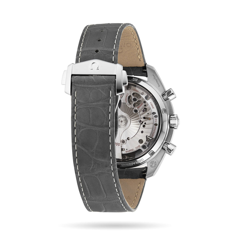 Back view of the OMEGA Speedmaster Racing, featuring a gray leather strap and a transparent case that reveals the internal mechanisms.