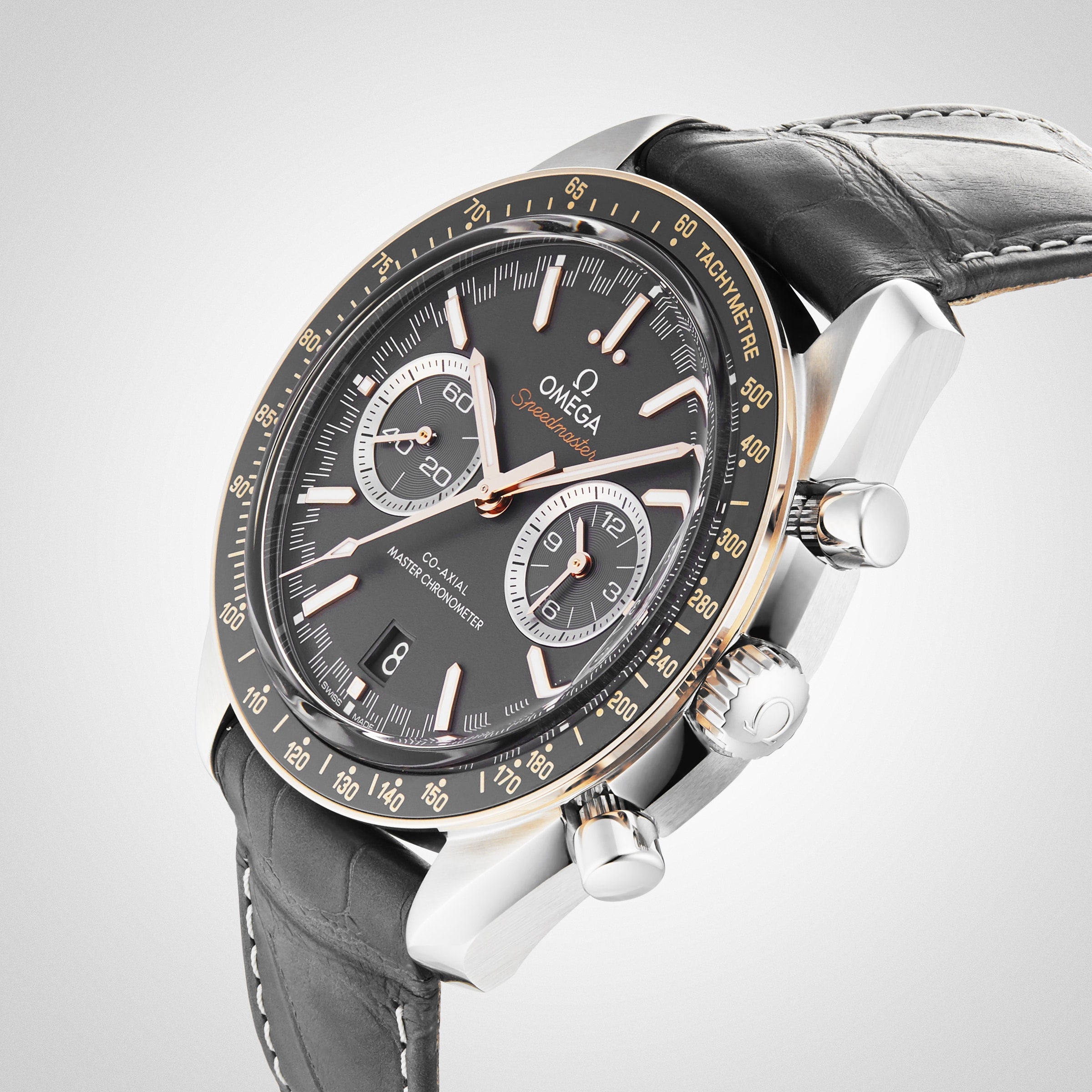 The OMEGA Speedmaster Racing is a luxury chronograph wristwatch with a black dial, leather strap, and three subdials.
