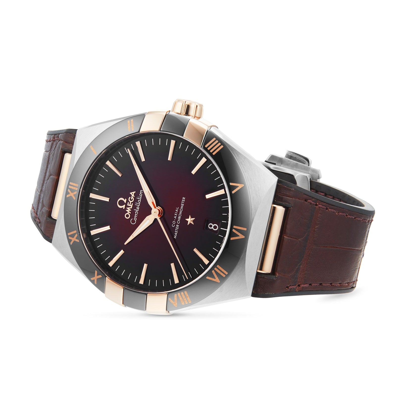 The OMEGA Constellation is a luxury wristwatch featuring a brown leather strap, black and gold bezel, burgundy dial with Roman numerals, date window at 3 o’clock, and the precise 8900 calibre movement.