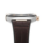Side view of the OMEGA Constellation wristwatch with a black dial featuring Roman numerals, a brown leather strap, and powered by the 8900 calibre movement.