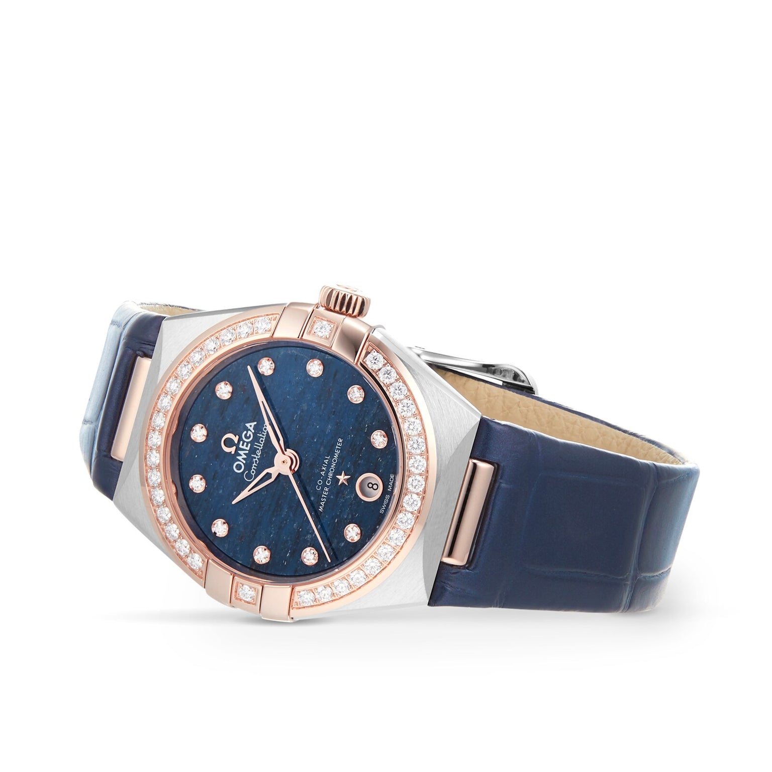 The OMEGA Constellation is a luxury watch with a blue leather strap, diamond-set bezel, blue dial with diamond hour markers, date window, and radiant 18K Sedna™ gold accents.