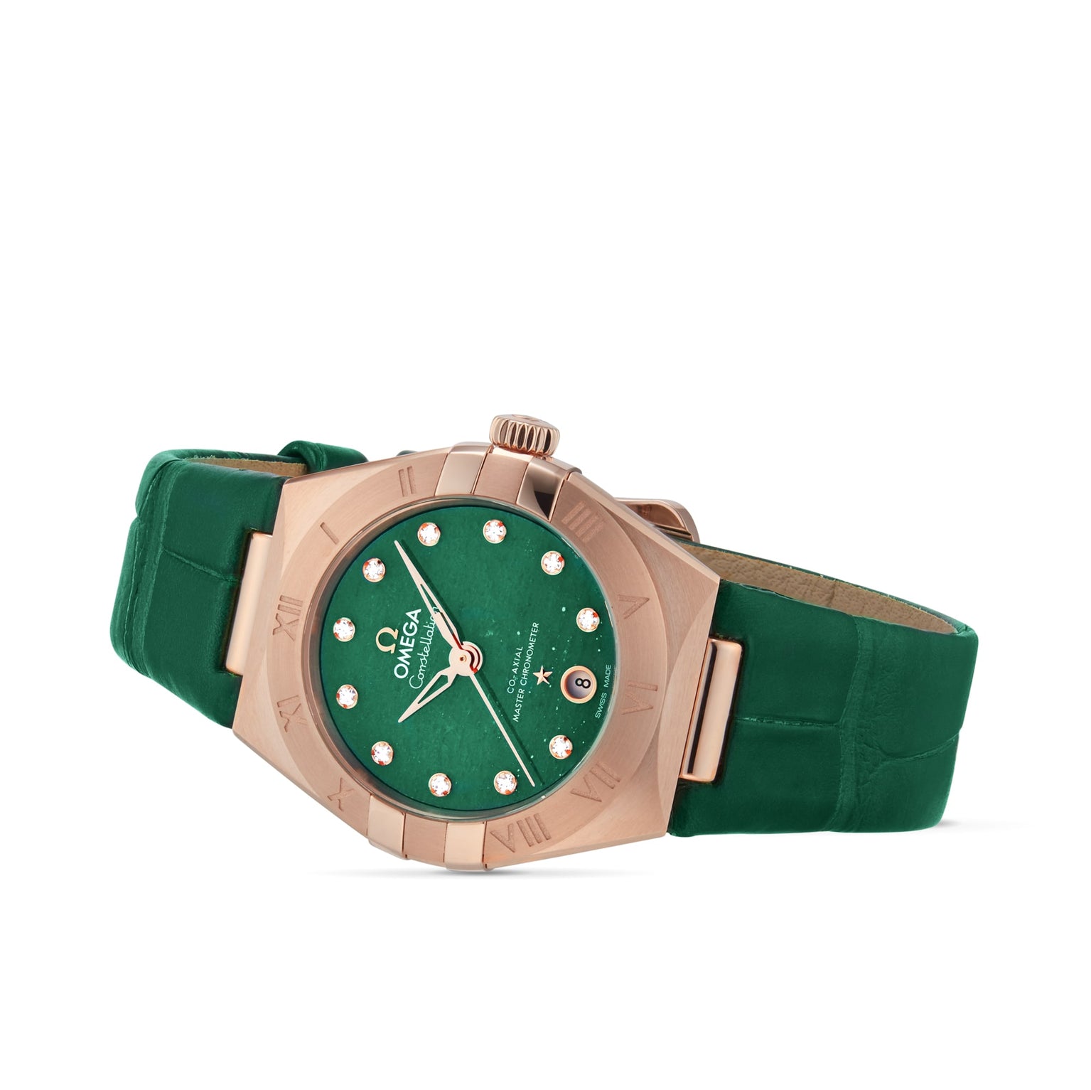 The OMEGA Constellation, in 18K Sedna™ rose gold with a green dial, diamond hour markers, date window, and green leather strap, is elegantly angled on a white background.
