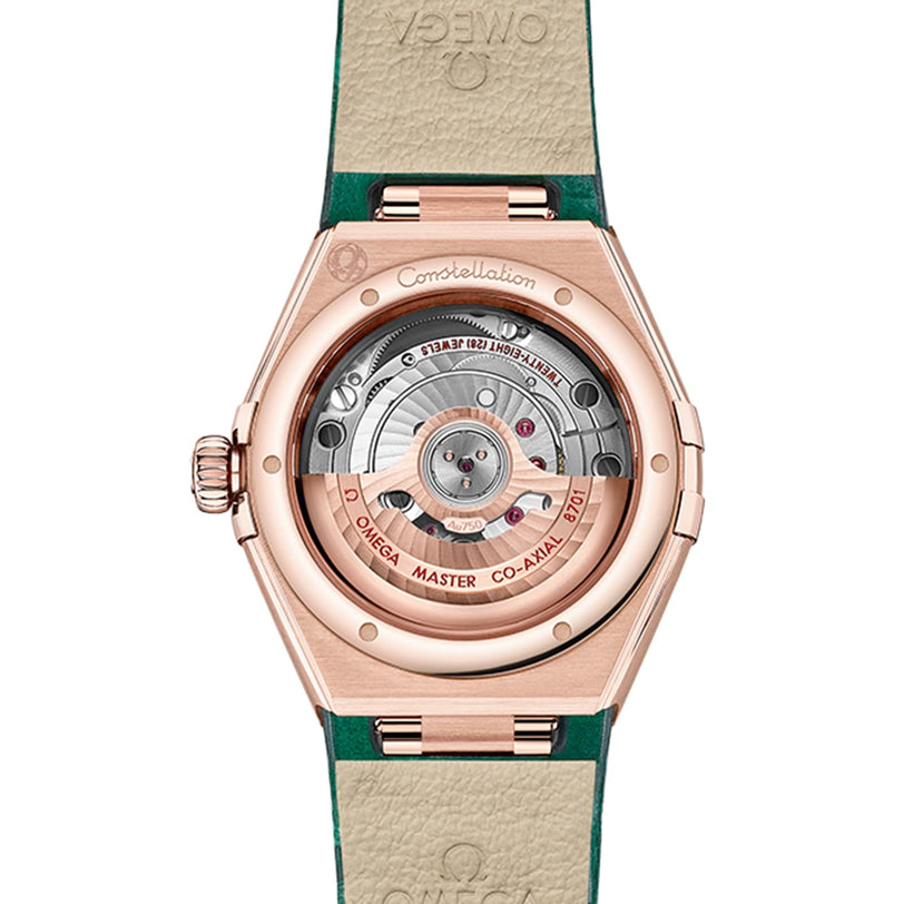 Back view of the OMEGA Constellation watch reveals its exposed mechanical movement, engraved rotor, and beige leather strap—featuring elegant Sedna™ gold accents and signature OMEGA branding.