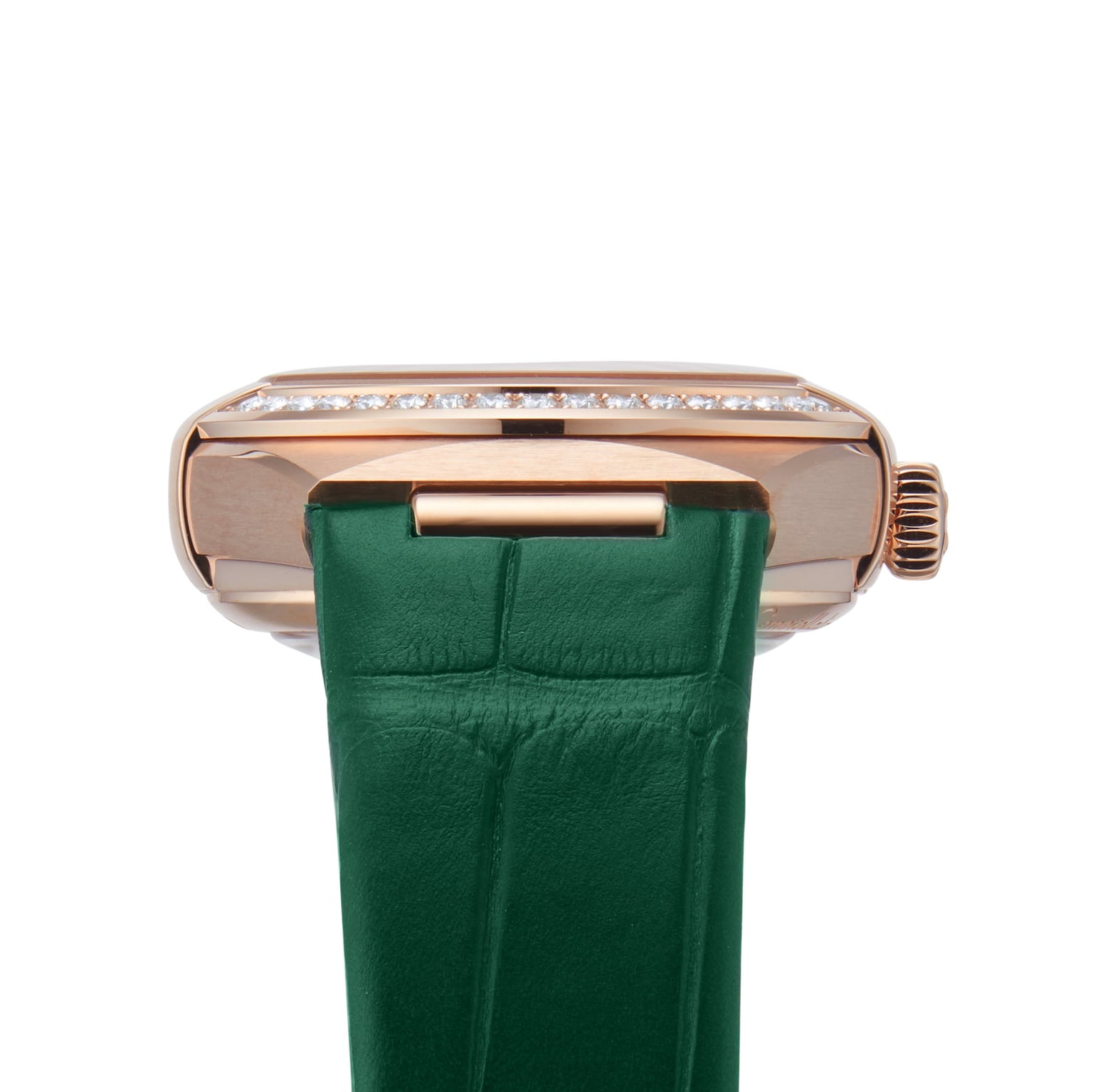 A close-up of the OMEGA Constellation shows its watch case adorned with a row of diamonds, Sedna™ gold accents, and a green leather strap.