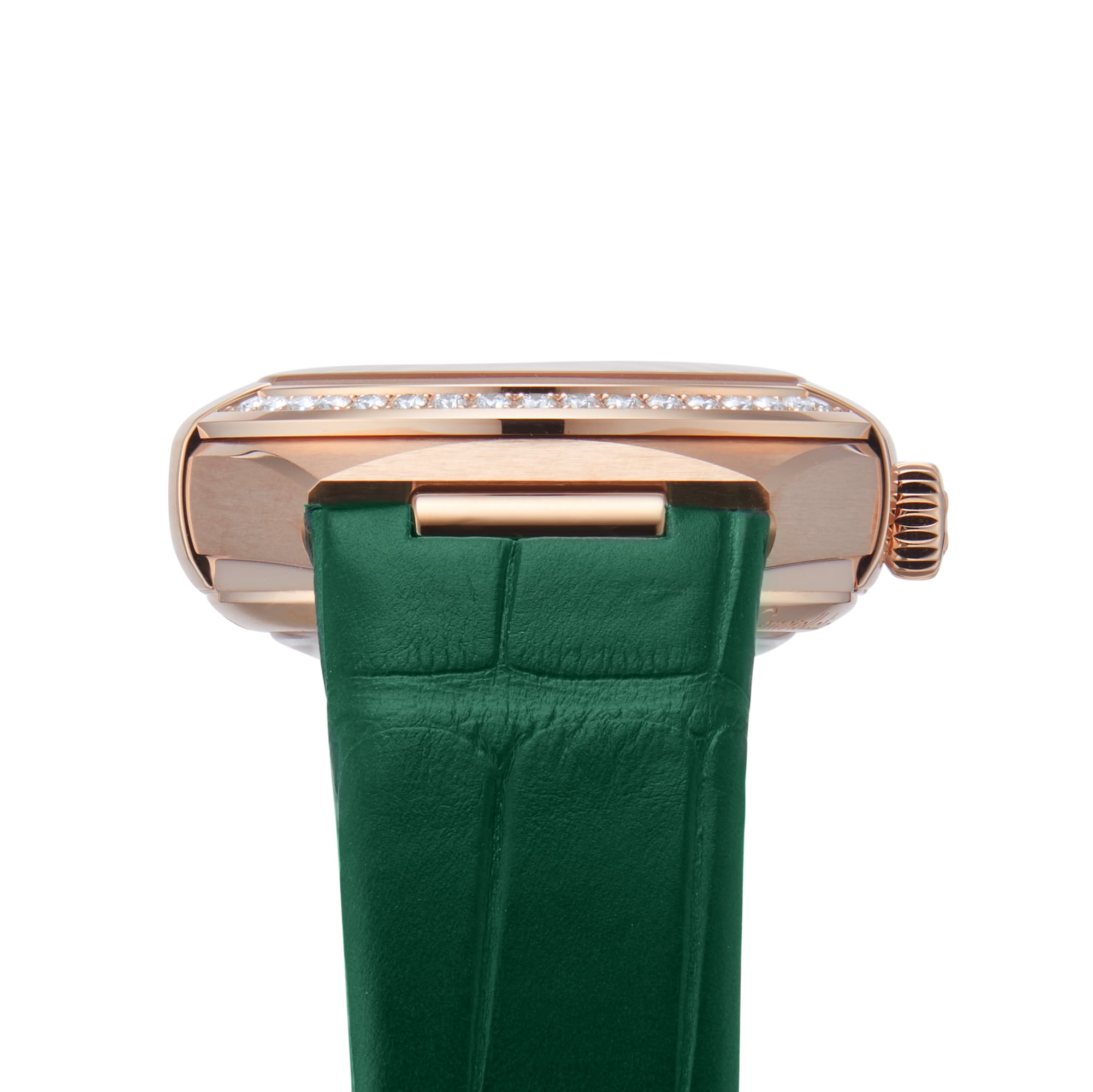 A close-up of the OMEGA Constellation shows its watch case adorned with a row of diamonds, Sedna™ gold accents, and a green leather strap.