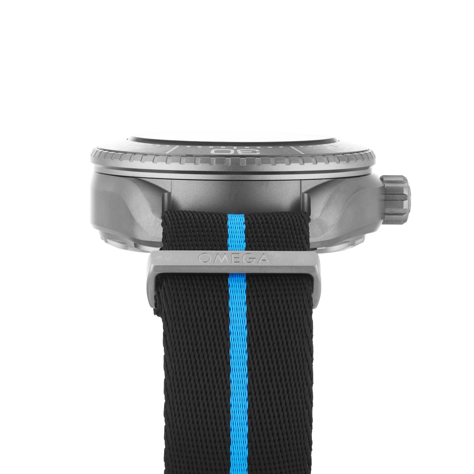 Side view of an OMEGA Seamaster Planet Ocean 6000M dive watch with a black strap featuring a blue stripe and “OMEGA” engraved on the metal loop, inspired by the Ultra Deep collection.