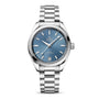 The OMEGA Seamaster Aqua Terra Shades is a stainless steel wristwatch featuring a blue dial, silver hour markers, a date display at 6 o’clock, and comes on a metal bracelet.