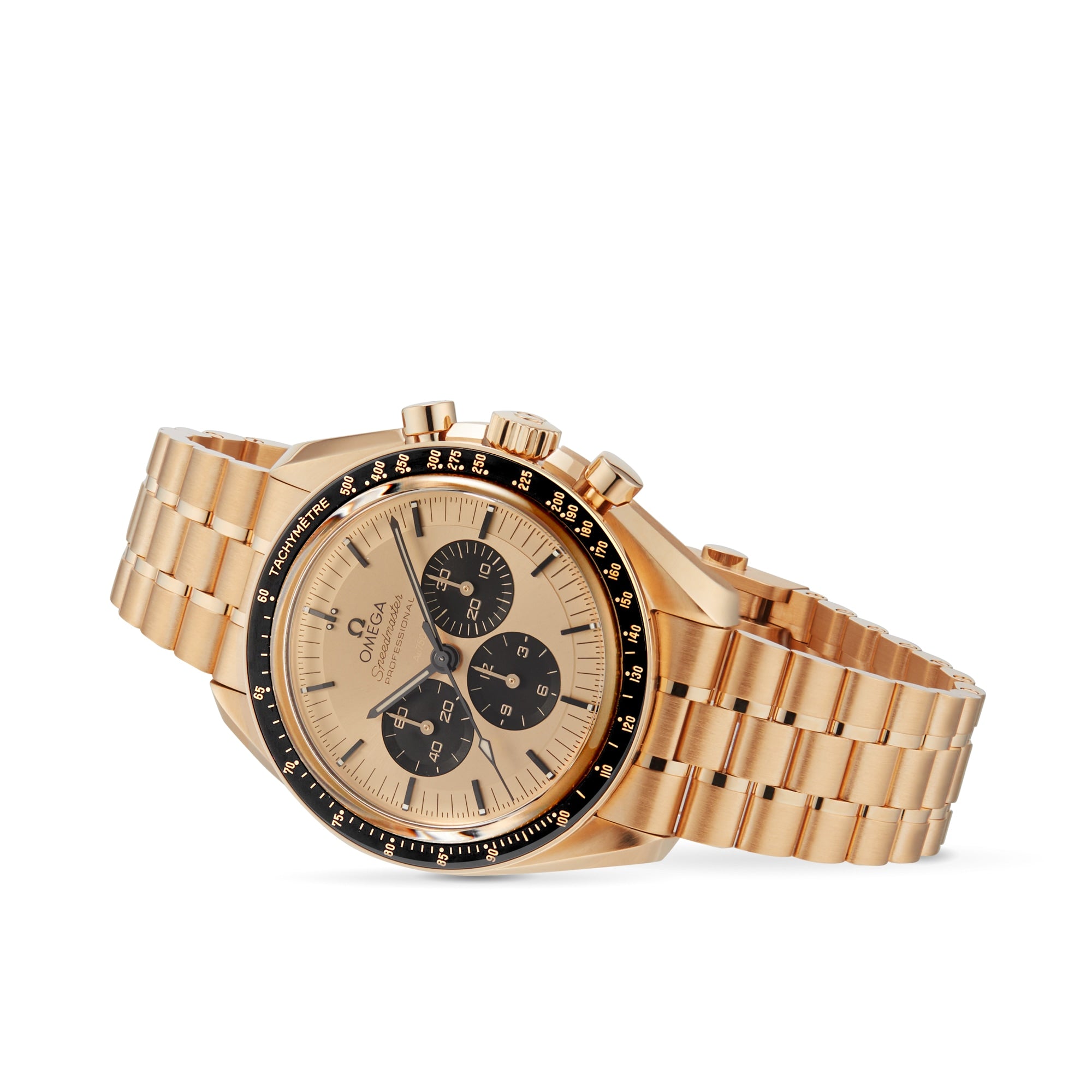 An OMEGA Speedmaster Moonwatch Professional with a gold Moonshine™ dial, three black subdials, a black bezel, and gold link bracelet, photographed against a white background.