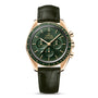 An OMEGA Speedmaster Moonwatch Professional wristwatch featuring a gold case, green dial with chronograph subdials, gold markers, and a dark green leather strap.