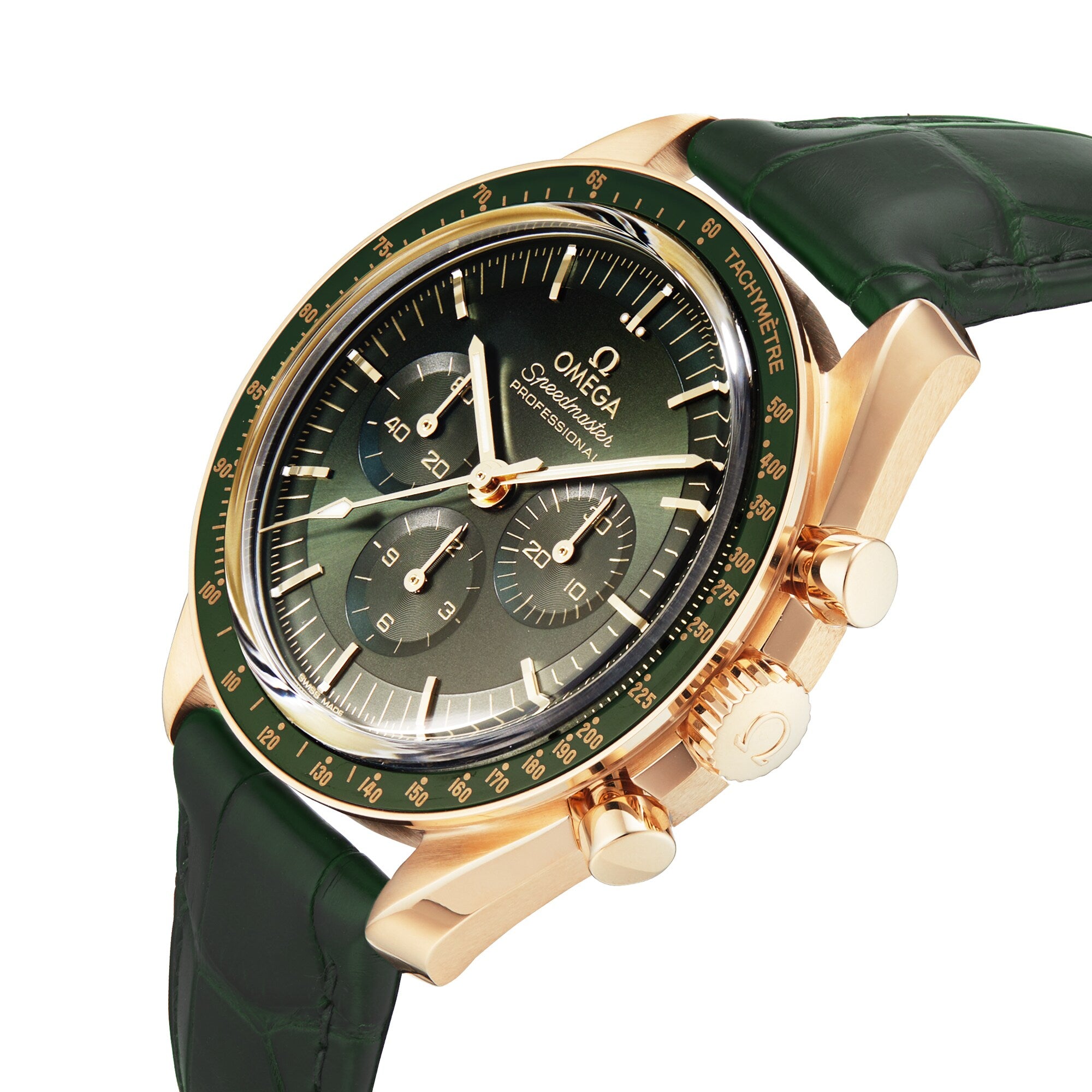 A gold OMEGA Speedmaster Moonwatch Professional with a green dial, three subdials, tachymeter scale, and dark green leather strap is angled on a white background, showcasing elegance and precision.