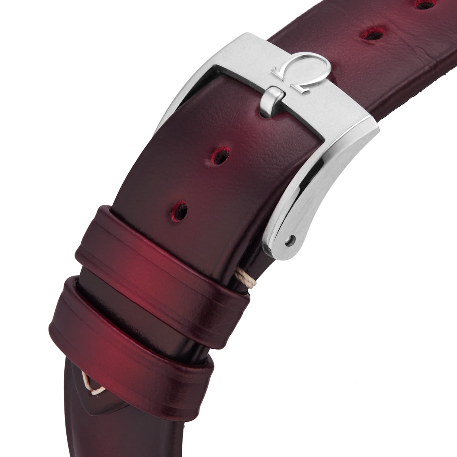 Close-up of a burgundy leather strap with a silver buckle featuring the OMEGA logo, designed for the iconic Speedmaster 57 chronograph.