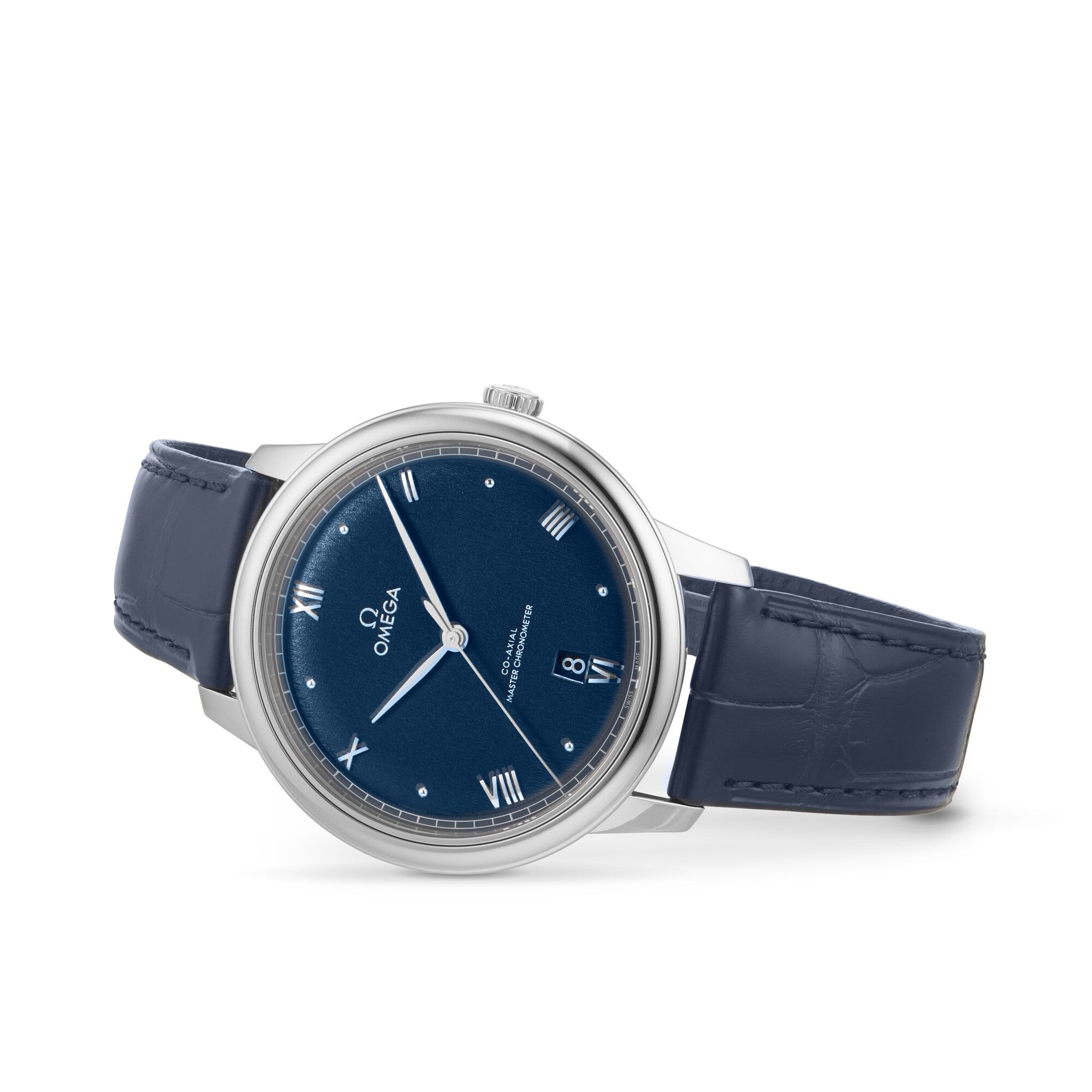 The OMEGA De Ville Prestige wristwatch features a blue dial with Roman numerals, date at 6 o’clock, blue leather strap, and Co-Axial 8800 calibre movement, shown on a white background.