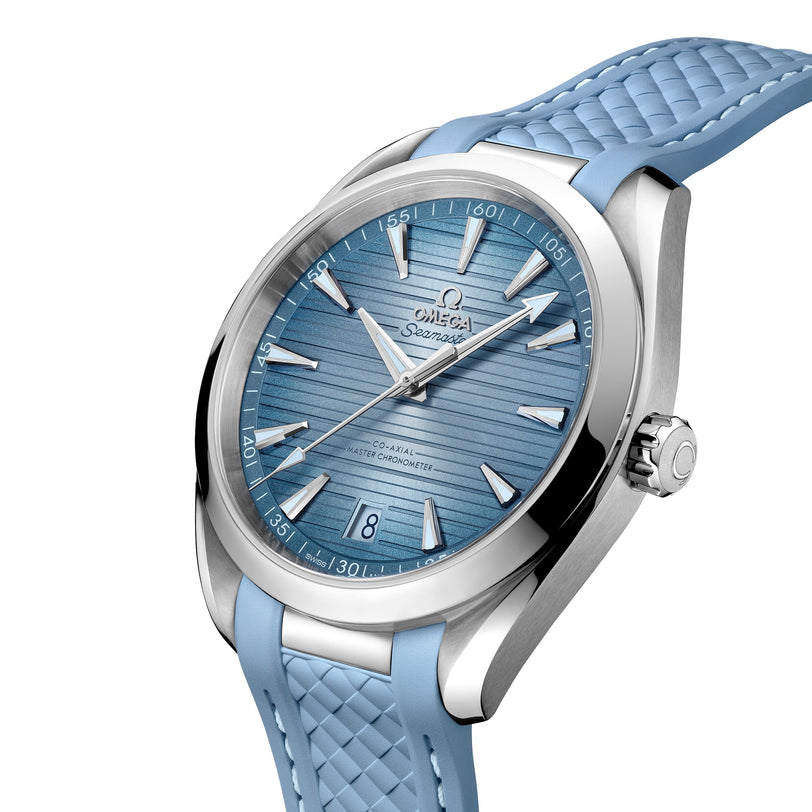 A close-up of the OMEGA Seamaster Aqua Terra 150M shows its light blue textured strap, matching dial, silver hour markers and hands, date window at six o’clock, and Master Chronometer certification—ideal for luxury sailboats.