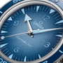 Close-up of the OMEGA Seamaster 300 Summer Blue, featuring a vibrant blue gradient dial, white hour markers, and silver hands, displaying the time at 10:09:38.