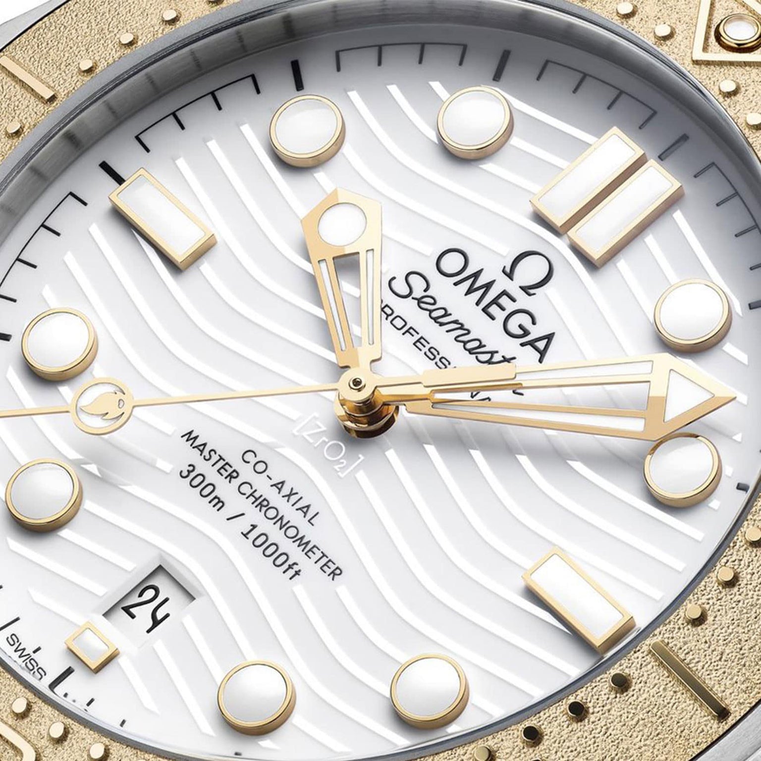 Close-up of the OMEGA Seamaster Diver 300M Paris 2024 watch face, featuring gold hands and indices, wave-patterned white dial, date at 6 o’clock, and branding details as Official Timekeeper for the Paris 2024 Olympic Games.