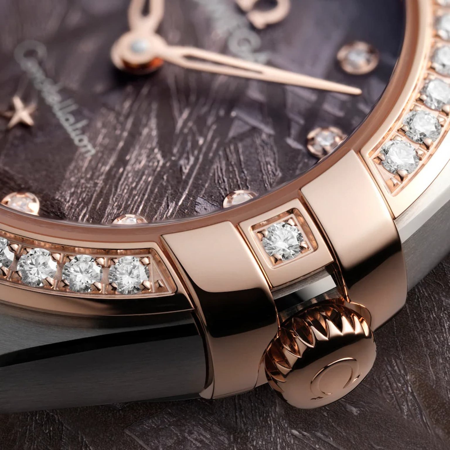 Close-up of the OMEGA Constellation, showcasing a diamond-paved bezel, rose gold case, meteorite dial, and sparkling diamond accents.