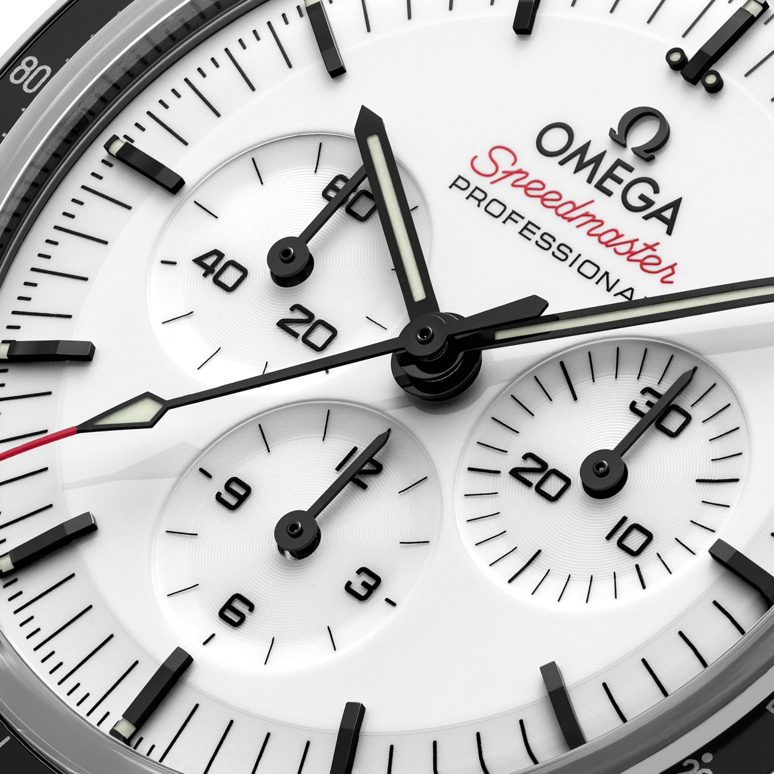 Close-up of the OMEGA Speedmaster Moonwatch Professional chronograph face featuring three subdials, black hour markers, and luminescent-accented hands.