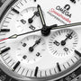 Close-up of the OMEGA Speedmaster Moonwatch Professional featuring a white dial, black hour markers, three subdials, and the Speedmaster Professional branding.