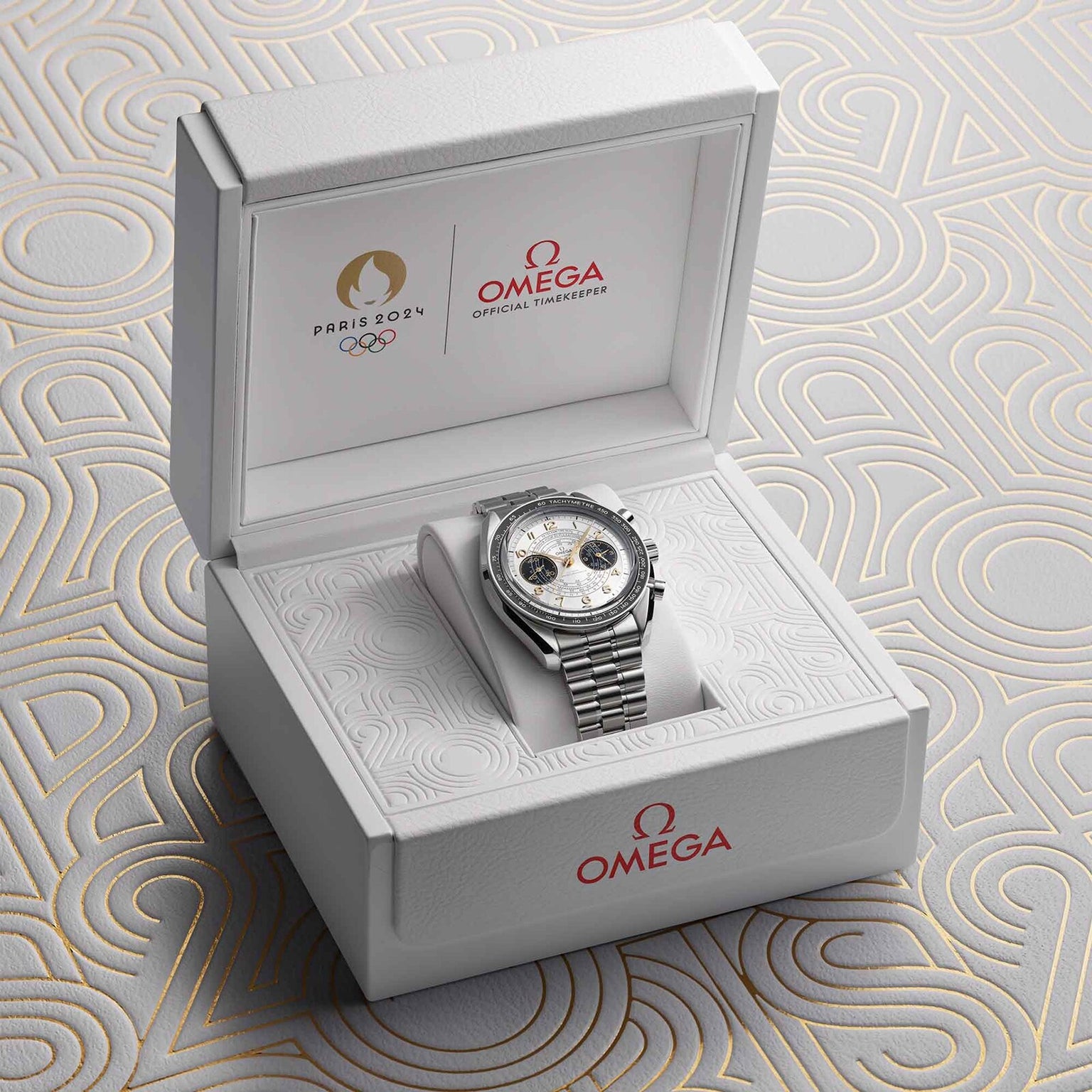 The OMEGA Speedmaster Chronoscope Paris 2024 Olympics comes in a white presentation box with Olympics Games Paris 2024 and OMEGA branding on the lid and inside.