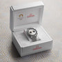 The OMEGA Speedmaster Chronoscope Paris 2024 Olympics comes in a white presentation box with Olympics Games Paris 2024 and OMEGA branding on the lid and inside.