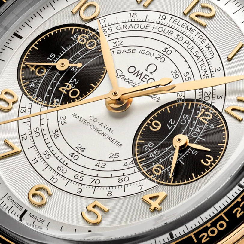 Close-up of the OMEGA Speedmaster Chronoscope Paris 2024 Olympics watch face, with gold numerals, chronograph subdials, and French calibration details—honoring OMEGA’s role as Official Timekeeper for the Paris 2024 Games.