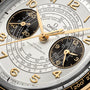 Close-up of the OMEGA Speedmaster Chronoscope Paris 2024 Olympics watch face, with gold numerals, chronograph subdials, and French calibration details—honoring OMEGA’s role as Official Timekeeper for the Paris 2024 Games.