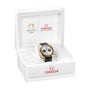 An OMEGA Speedmaster Chronoscope Paris 2024 Olympics wristwatch with a gold and silver case, black strap, Master Chronometer certification, and Olympic Games Paris 2024 branding, displayed in an open white OMEGA box.