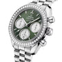 The OMEGA Speedmaster 38 is a stainless steel chronograph watch with a green dial, three subdials, diamond-set bezel, and a metal link bracelet.