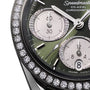 Close-up of the OMEGA Speedmaster 38 wristwatch featuring a green dial, diamond bezel, three subdials, and the OMEGA Co-Axial Calibre 3330 Chronometer label.