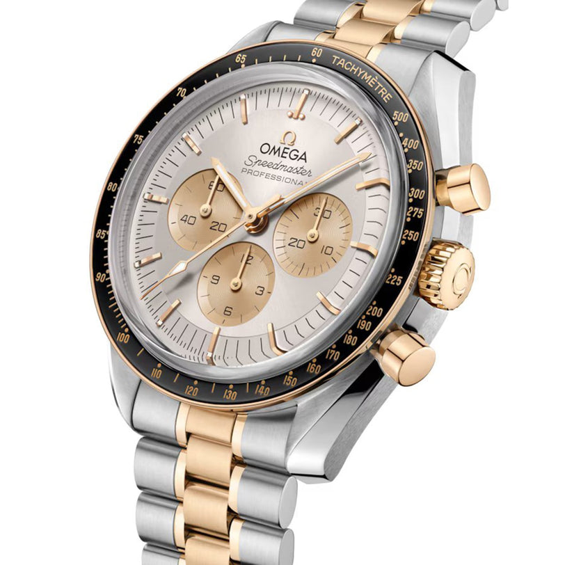 A close-up of the OMEGA Speedmaster Moonwatch Professional Moonshine, showcasing a silver and gold bracelet, gold pushers, a white dial with three subdials, a tachymeter bezel, and powered by the advanced Omega 3861 calibre.