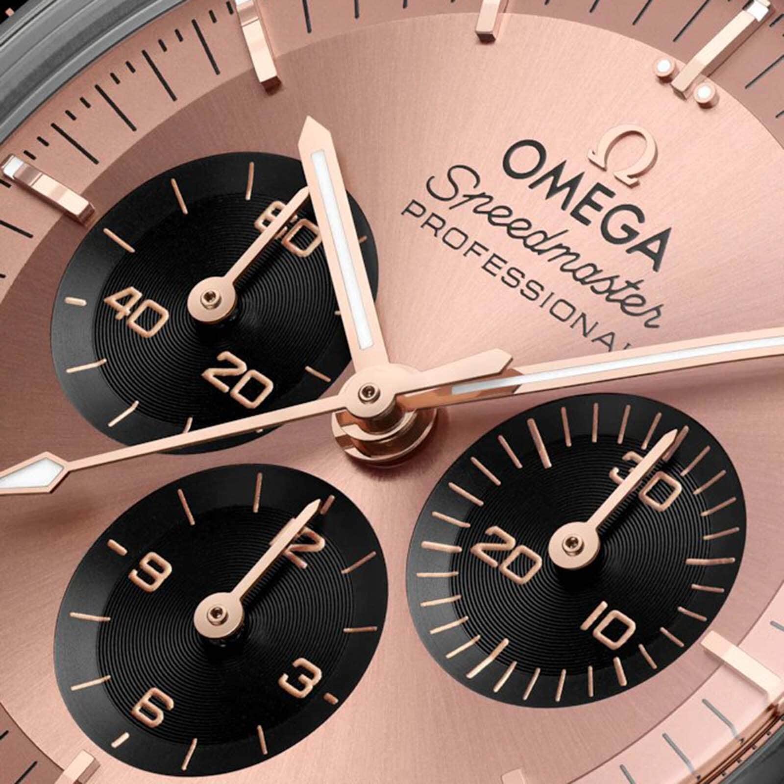 Close-up of the OMEGA Speedmaster Moonwatch Professional Sedna, showcasing rose gold hands in Sedna™ Gold and three black sub-dials for seconds, minutes, and hours.