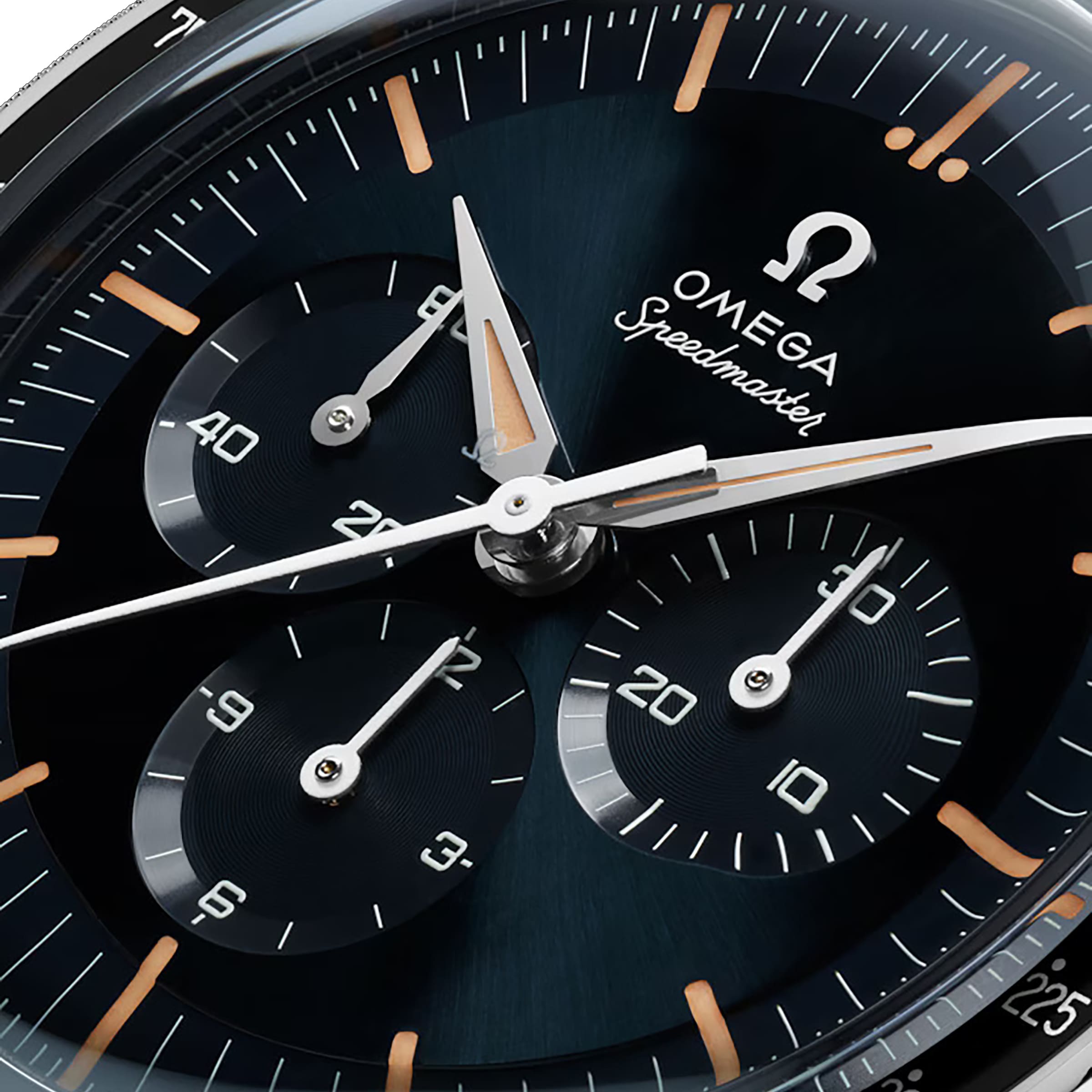 Close-up of the OMEGA Speedmaster First OMEGA in Space watch face with a tachymeter scale, three subdials, silver hands, hour markers, and the prominent OMEGA logo and Speedmaster text on a dark background.