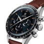 An OMEGA Speedmaster Anniversary Series wristwatch in stainless steel, featuring a black dial with three subdials, a tachymeter bezel, and a brown leather strap.