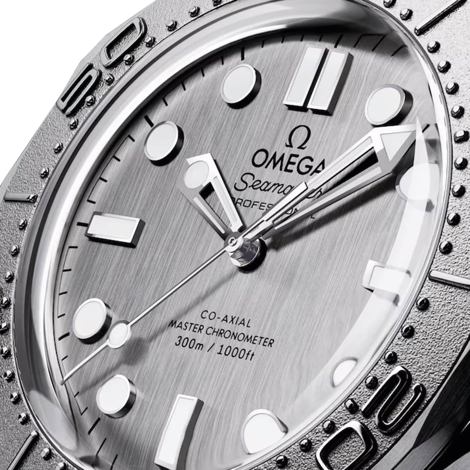 Close-up of the OMEGA Seamaster Diver 300M watch face, displaying stainless steel silver hands, white hour markers, and a detailed bezel with 300m / 1000ft water resistance text.